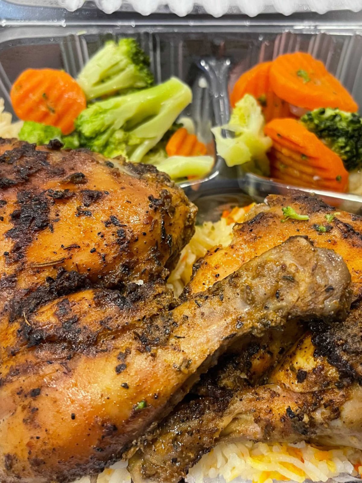 A finished plate of chicken and vegetables from the Hot Meals program